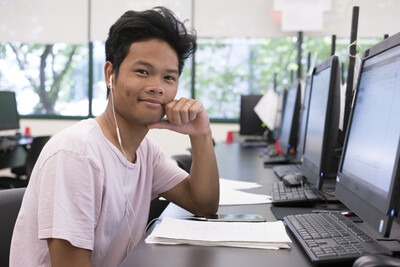 Student in the Cyber Defense Center at a computer