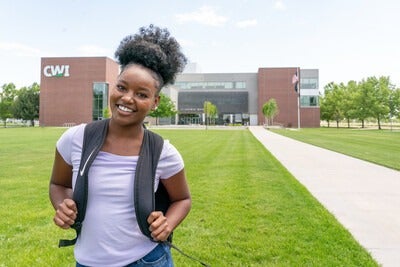 Student outside of Nampa Campus Academic Building