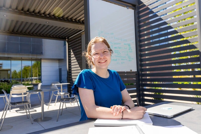 Student studying in outdoor campus common area