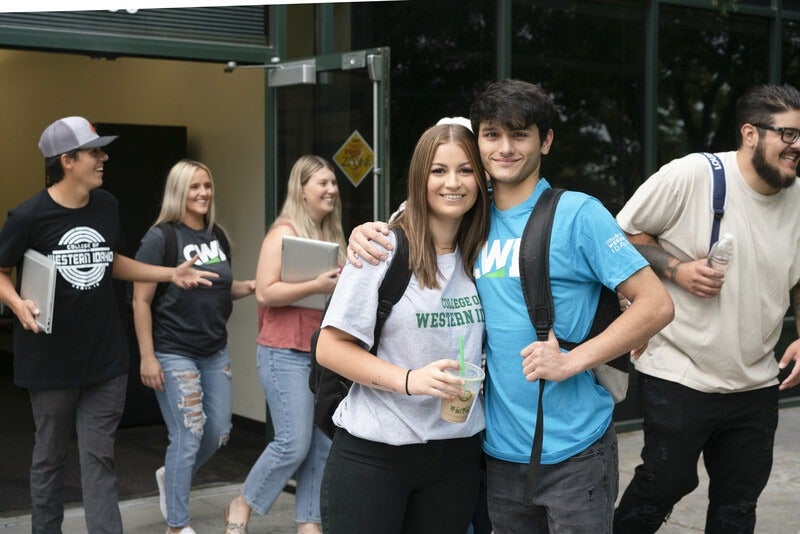 Students exiting a campus building
