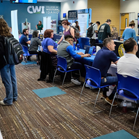 Groups of people chatting at tables