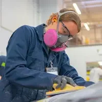 Student working on vehicle