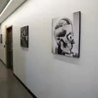 Pictures and photos hung on walls of Health and Science Building