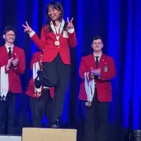 Student poses at awards ceremony