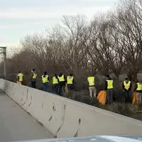 Students picking up trash on I84