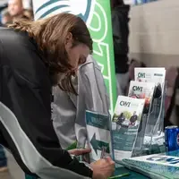 Student signs up for scholarship drawing