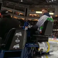 Student with CWI hockey jersey rides zamboni