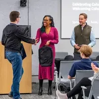 Graduate shaking Micron leadership's hands