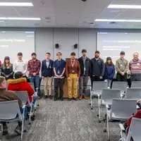 New Apprentices stand in front of audience