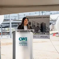 Feliciti Huarancca Mesicano speaking at a podium