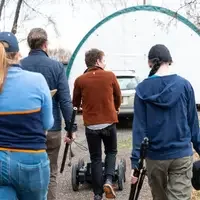 People walking with equipment