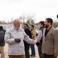People chatting with each other in a crowd