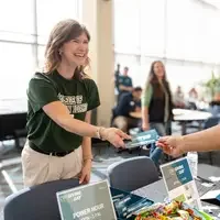 Woman receives thank you card for Giving Day