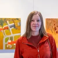 Person in front of art