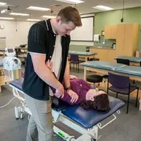 Austin Davis working on a patient in the lab