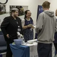 CWI employees meeting with prospective students