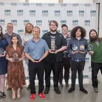 Club award winners gather in front of a CWI backdrop
