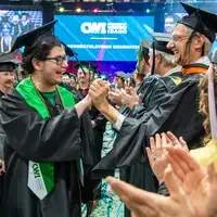 Graduate celebrating with instructor