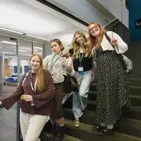 Students line up on the stairs