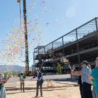 Beam being raised with confetti surrounding