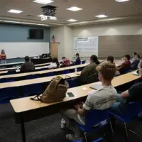 Audience watching speech student