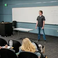 Student presents to a panel of judges