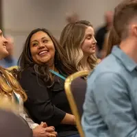 Student smiles in crowd