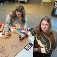 Students working on a cardboard project