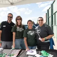 CWI employees standing at a booth
