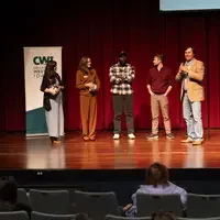 Winners line up on stage