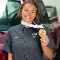Autumn Harvey wearing her medal