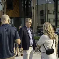 Gordon Jones chatting with faculty and staff