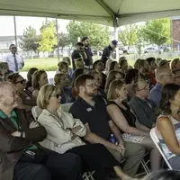 Staff and faculty sit in audience