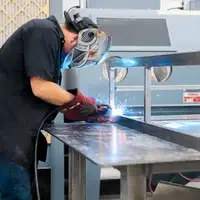 Students welding in lab