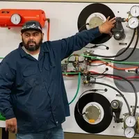 Instructor points to wires and equipment