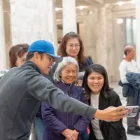 Group of people take a selfie on phone