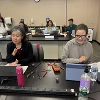 Roxana working in class with another student