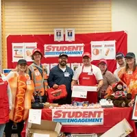 Group of people dressed as Costco employees