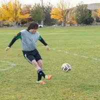 Player kicking a soccer ball