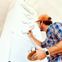 Painter working on a mural