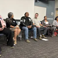 People sitting together in chairs 