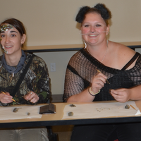 UROC students ready to help kids play games at the Halloween party.