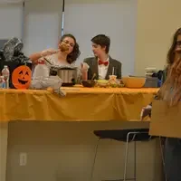 UROC students sitting at table with food.