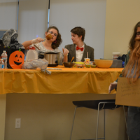UROC students sitting at table with food.