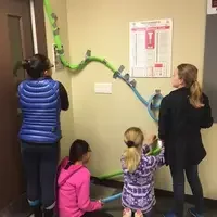 Students in classroom at STEM out building rollercoasters