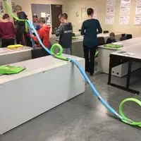 Students in classroom at STEM out building rollercoasters