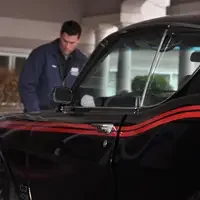 Students working on car