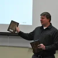 Speech and Debate team with awards presentation