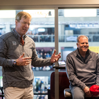 A man speaks to an audience.