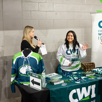 A reporter interviews a representative from CWI.